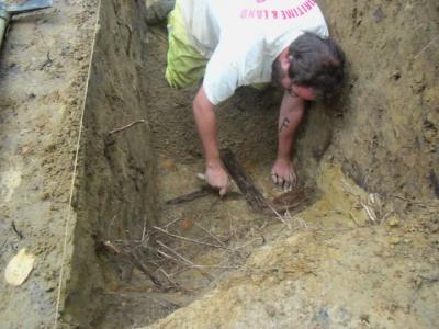 Figure 1 - Author discovering wooden trench boarding, Ypres 2010 (Image Copyright - Alex Sotheran)