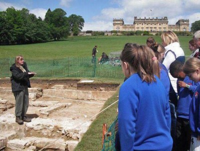 Figure 1: Author giving a site tour to a group of local schoolchildren (Image Copyright: Emily Rayner)